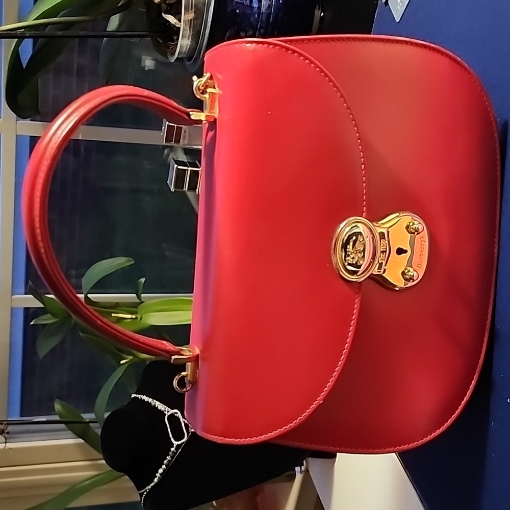 Burberry Vintage Top Handle bag with Gold Tone hardware.